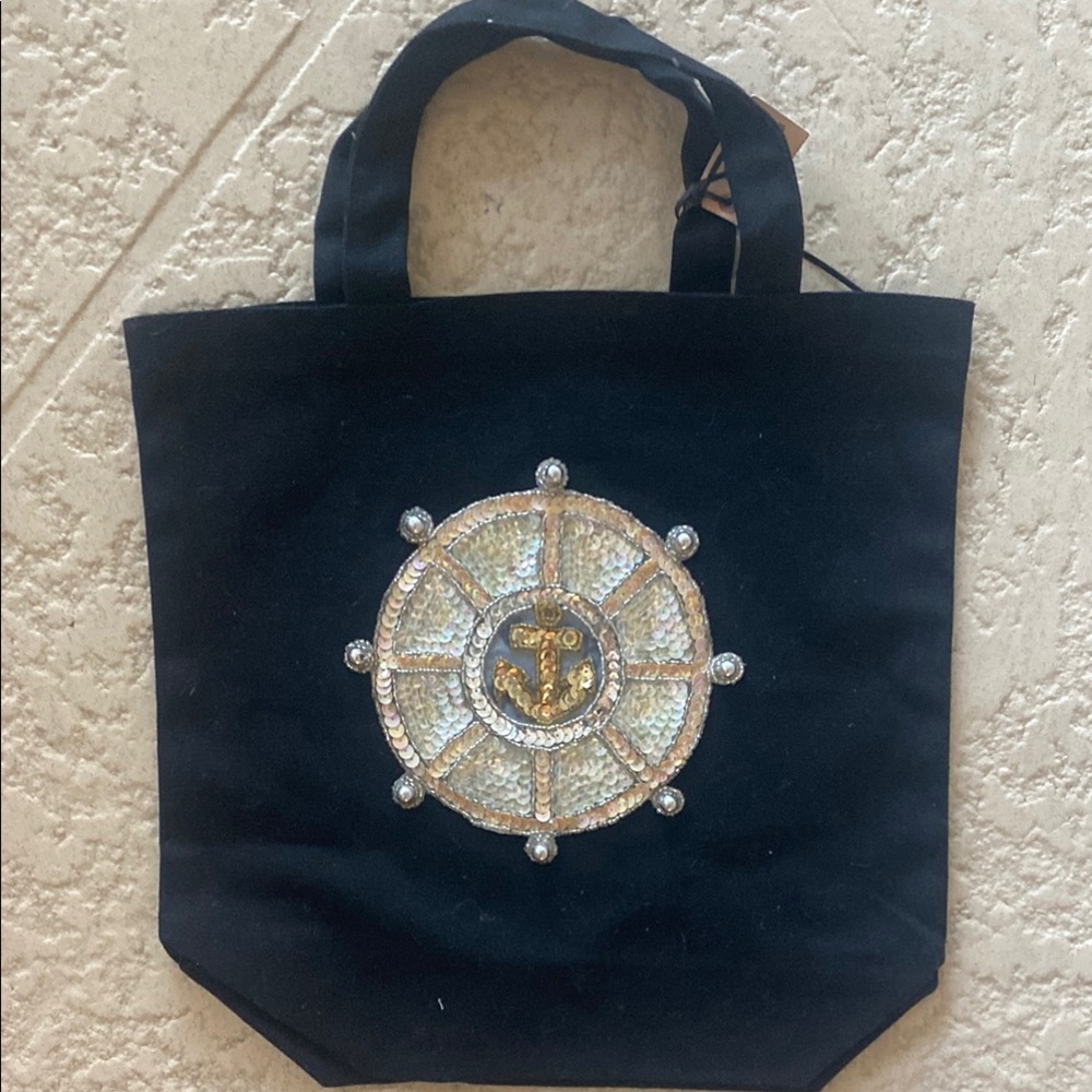 Black and Gold Tote with Intricate Emblem Design